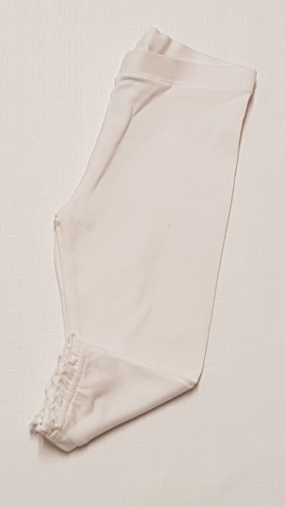 F&F KIDS FEHÉR SZÍNŰ,CSIPKÉS ALJÚ KISLÁNY LEGGING 74