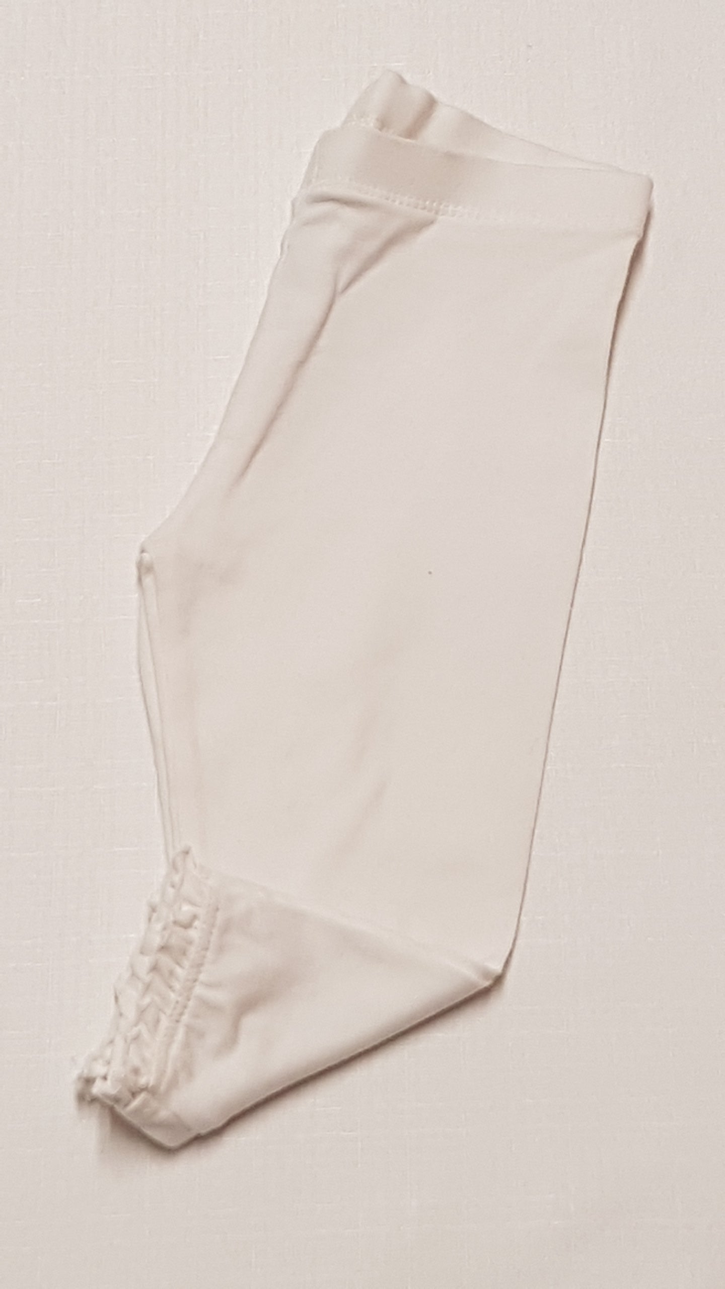 F&F KIDS FEHÉR SZÍNŰ,CSIPKÉS ALJÚ KISLÁNY LEGGING 74