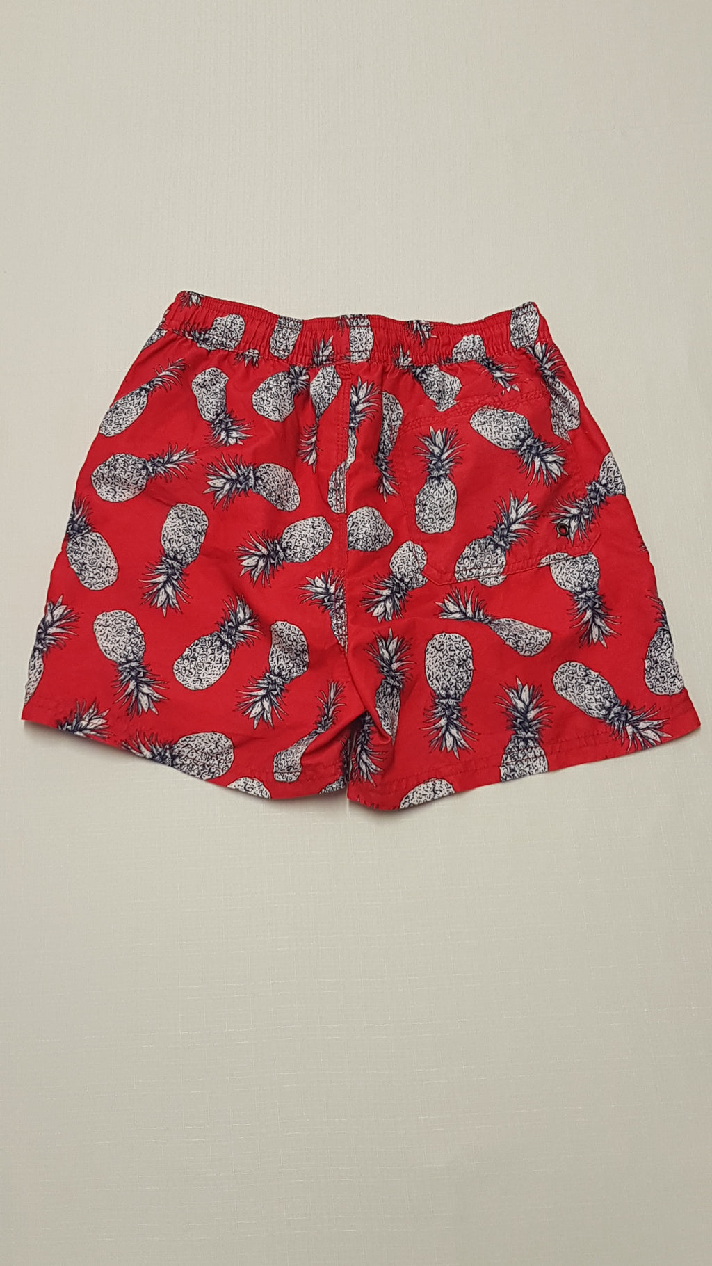 NEXT VAGÁNY ANANÁSZ MINTÁS,HÁLÓS BELSEJŰ KISFIÚ FÜRDŐNACI 146